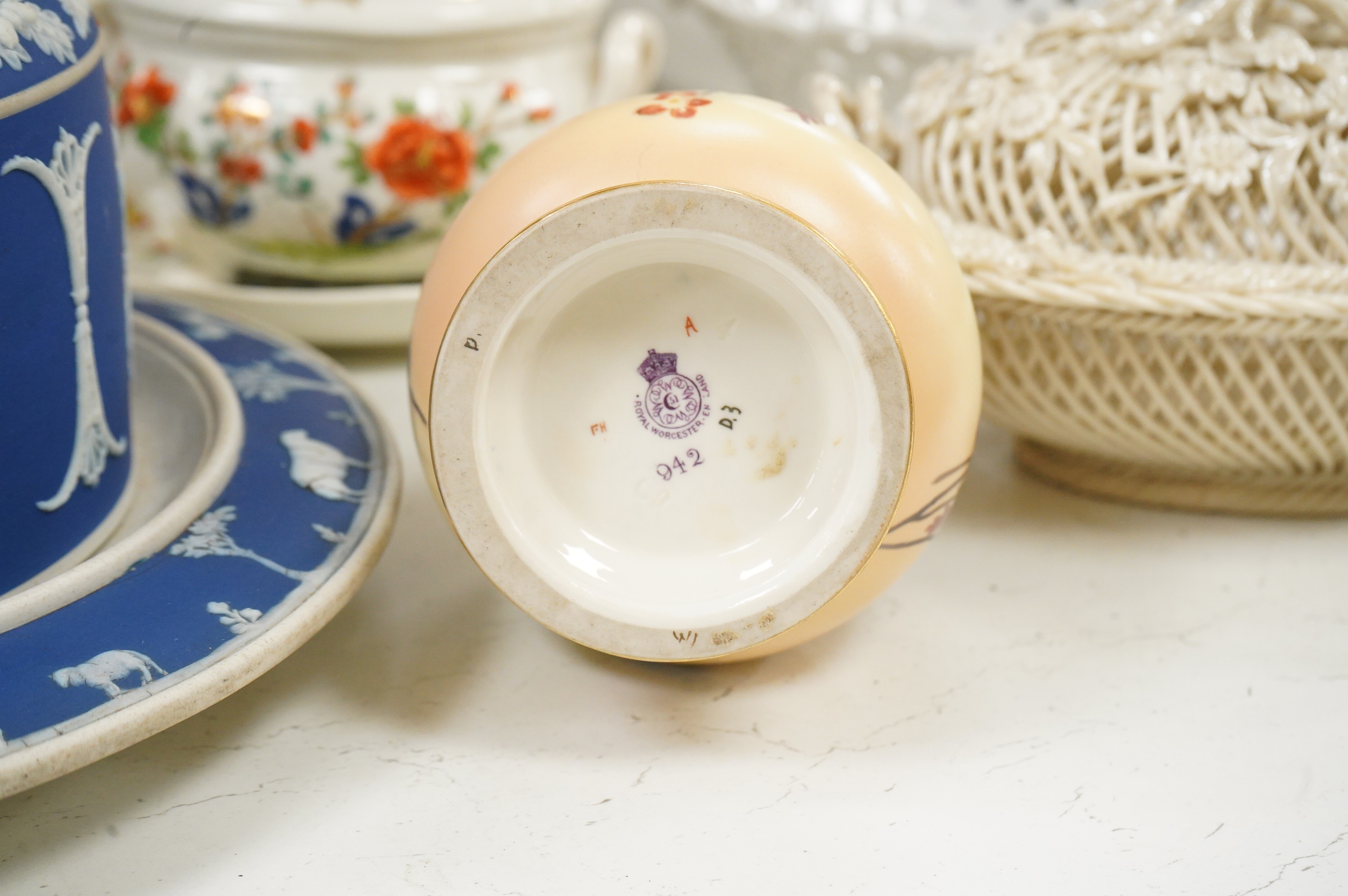 A 19th century Derby tureen and cover, a pair of Royal Worcester blush vase-26cm high, a Belleek basket and cover, a Wedgwood blue Jasperware cheese dish and associated cover, two continental baskets and vase. (7).